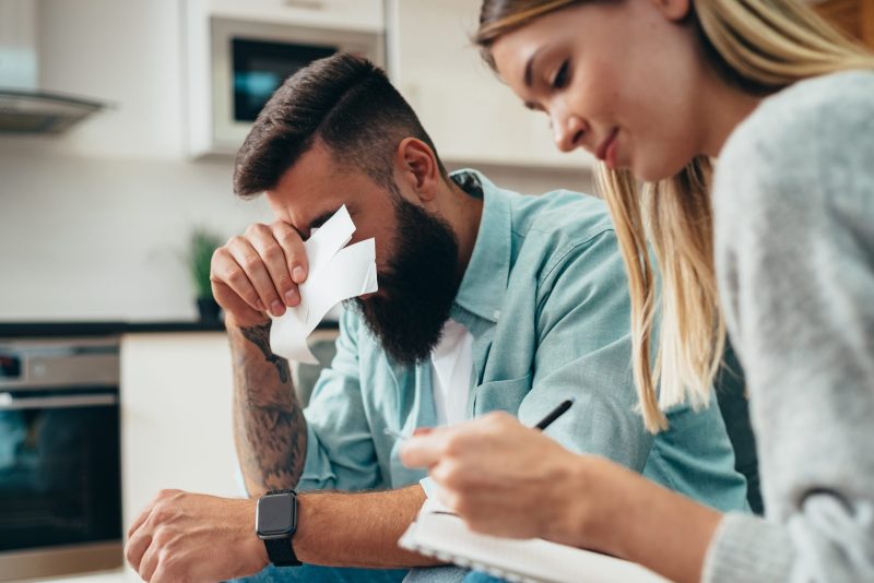 Couple going through their monthly expenses