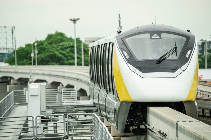 Elevated monorail train on rail. Public transit monorail. Modern mass transit. Electric vehicles.